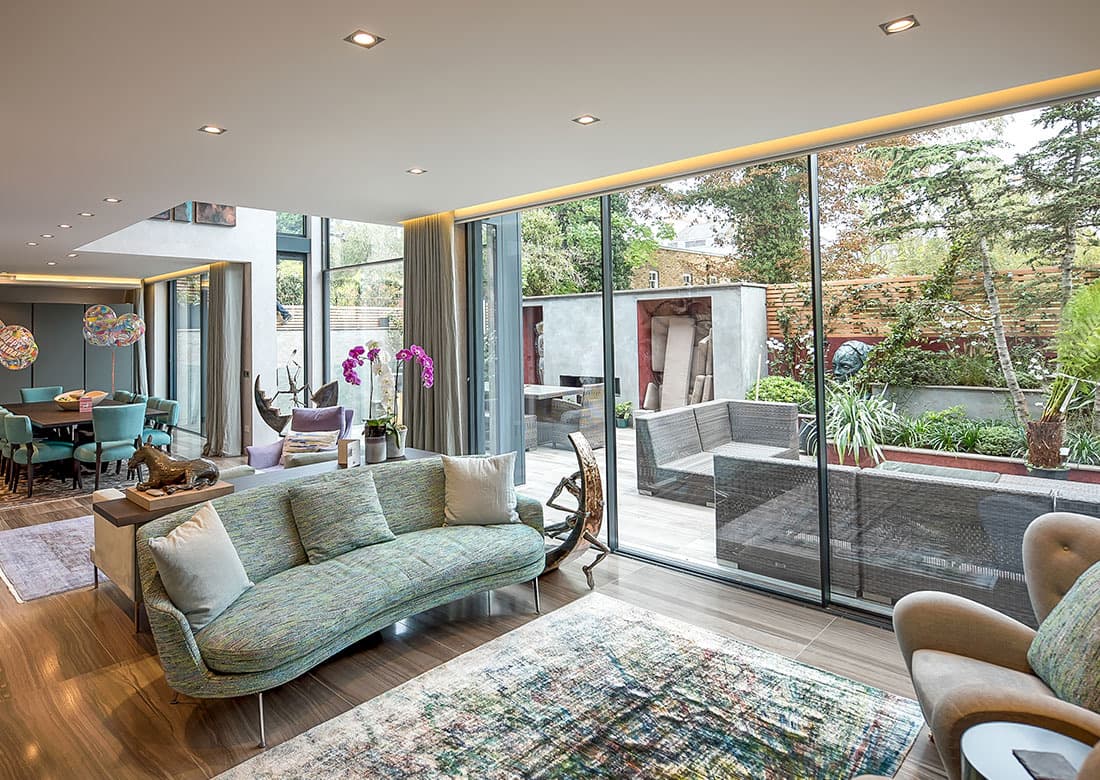 An open-plan living space at Abercorn Place opening onto its garden terrace