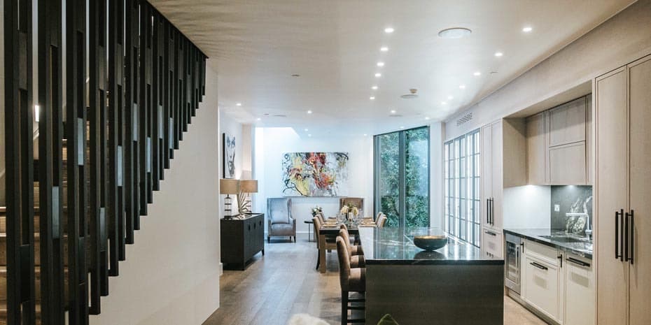 The contemporary staircase and kitchen at Pitt Street